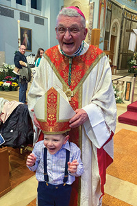 Bishop Zubik and a young friend were all smiles after Easter Sunday Mass.