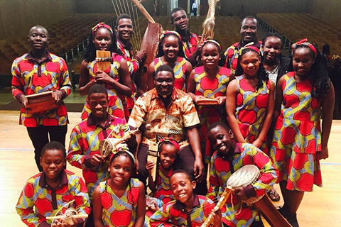 Fr. Ouma with the SoZo Children Choir of Uganda at the Immaculate Conception School in Towson, April 2016.