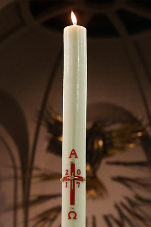 Lit Paschal Candle at Easter.